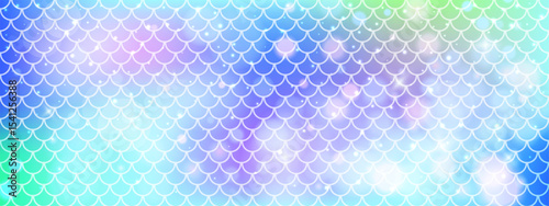 Mermaid scale pattern with soft gradients.  Rainbow background with seamless fish or dragon tail texture. Blue decorative layout in vector format.