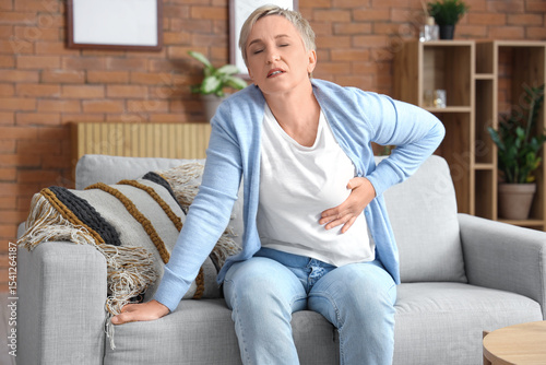 Mature woman having heart a...