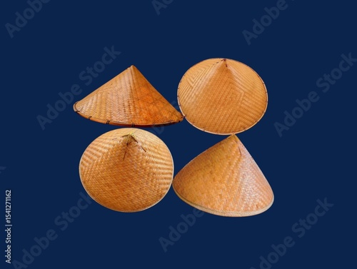The dark blue background in the picture is a beautiful, intricately woven basket made from bamboo painted in beautiful brown colors. There is a head cover inside that is made into a circle. 