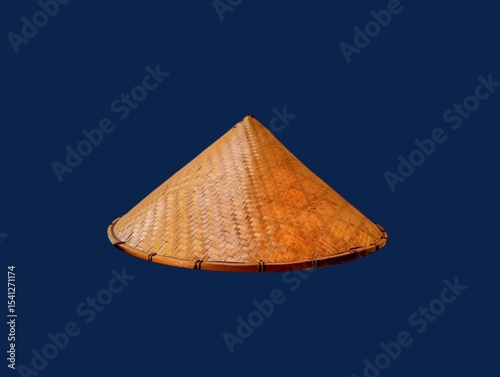 The dark blue background in the picture is a beautiful, intricately woven basket made from bamboo painted in beautiful brown colors. There is a head cover inside that is made into a circle. 