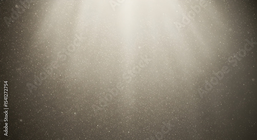 Beige light shafts with dust particles create a textured background or effect
