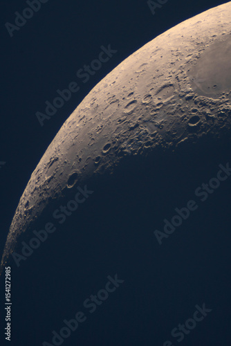 High-resolution view shows rugged lunar crescent crater landscape. High-Resolution Close-Up of the Moon's Terminator Line with Craters