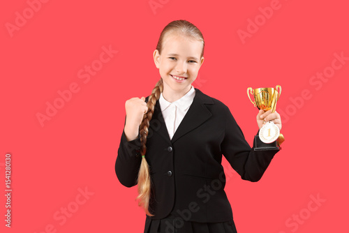 Cute little schoolgirl with...