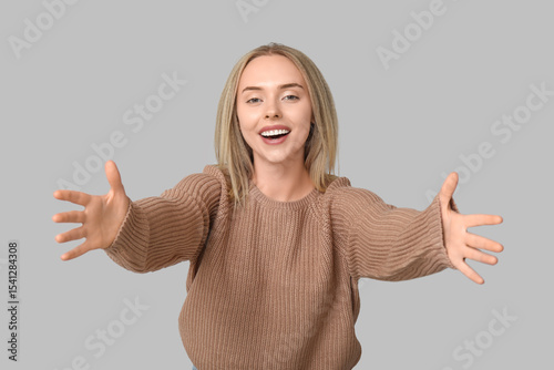 Young woman opening arms fo...