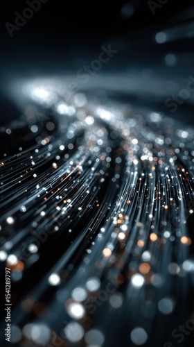 Close-up of illuminated fiber optic cables with a bokeh effect
