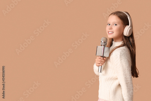 Cute girl in headphones wit...