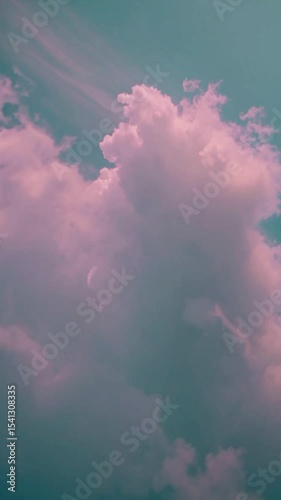 Vertical video Cloudy pastel sky. Fluffy clouds moving on green, blue sky with clouds and sun. 4K Time lapse, Sky with clouds. Beautiful background