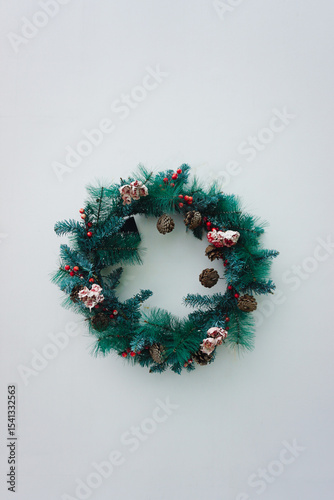 Christmas ring ornament on white wall background