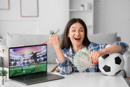 Happy young woman with mone...