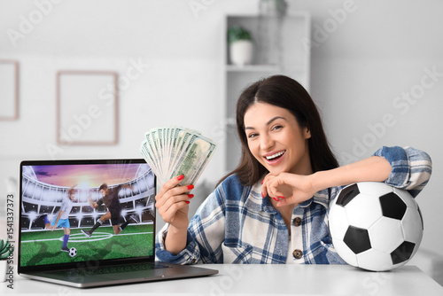 Happy young woman with mone...