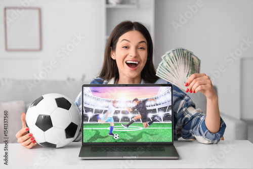 Happy young woman with mone...