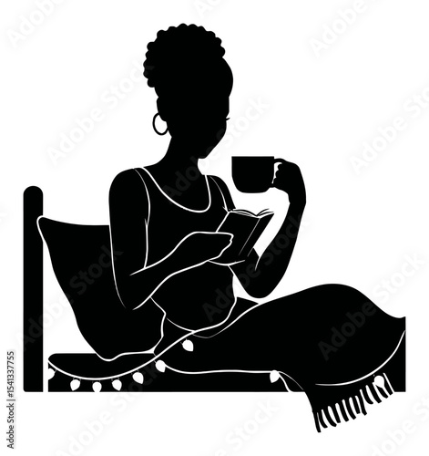 Silhouette of Woman Reading a Book While Relaxing on a Bed with Mug