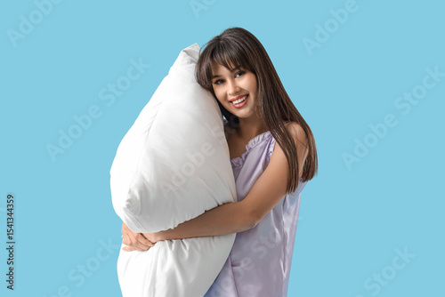 Young woman in pajamas with...