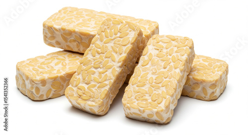 Stacked tempeh blocks on white background