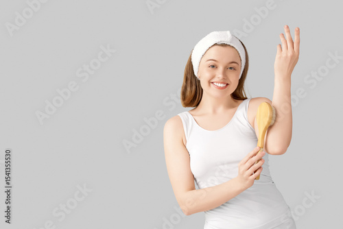Young woman massaging her a...