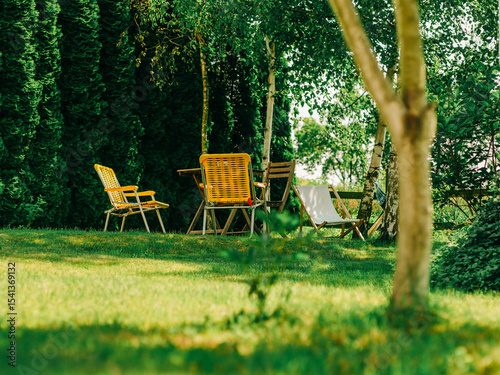 Yellow Folding Chairs in Summer Garden