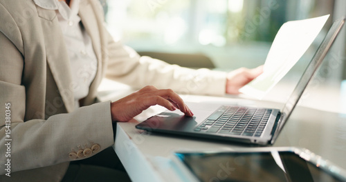 Fotografie Hands, business woman and laptop with document for typing, comparison and accounting