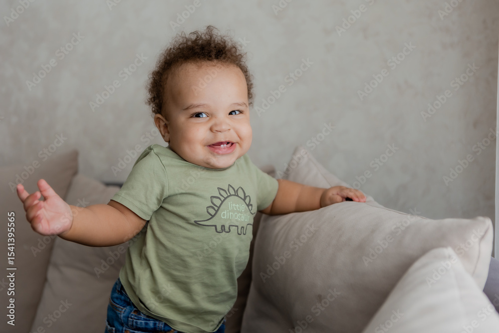 Fototapeta premium portrait of an African-American baby smiling at home