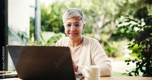 Senior woman, laptop and smile at house of finance report, loan application and review budget. Elderly person, reading and PC of mortgage payment, expenses information and balance account in backyard
