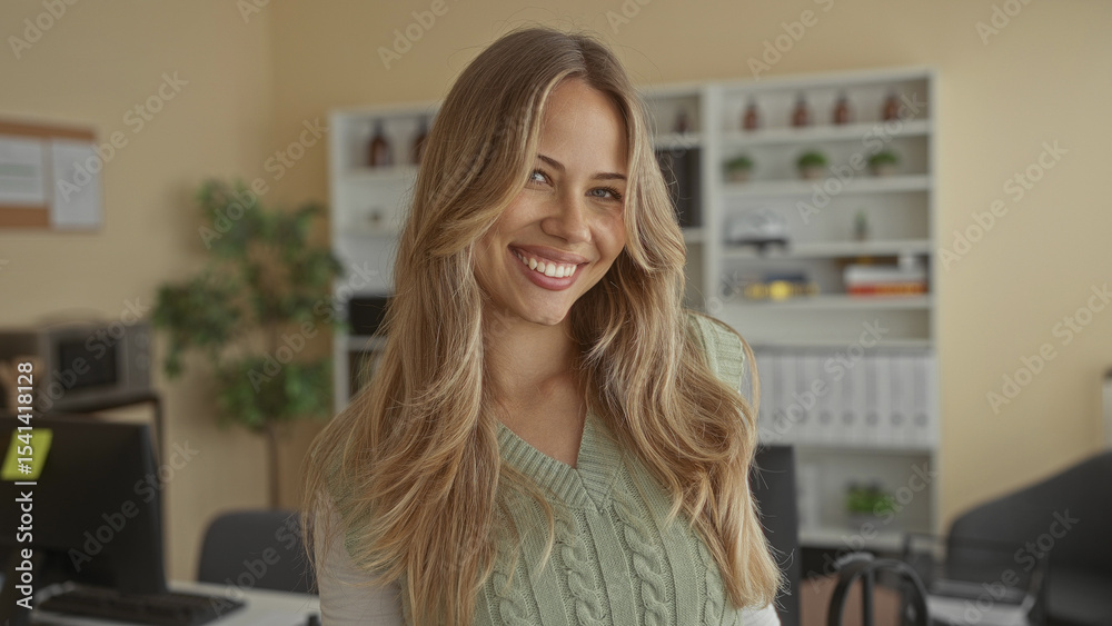 Αυτοκόλλητο Woman with blonde hair holds eyeglasses near face with hand amidst desk setup in office; clarity ease concentration relief