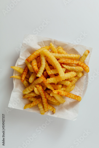 Obraz na plátně Crispy Golden French Fries on White Background for Food Photography