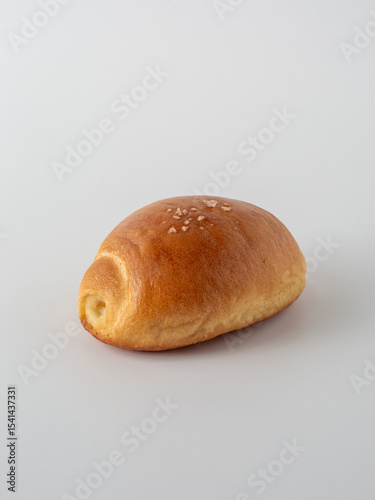 Freshly Baked Golden Brown Bread Roll with Light Sprinkle of Salt
