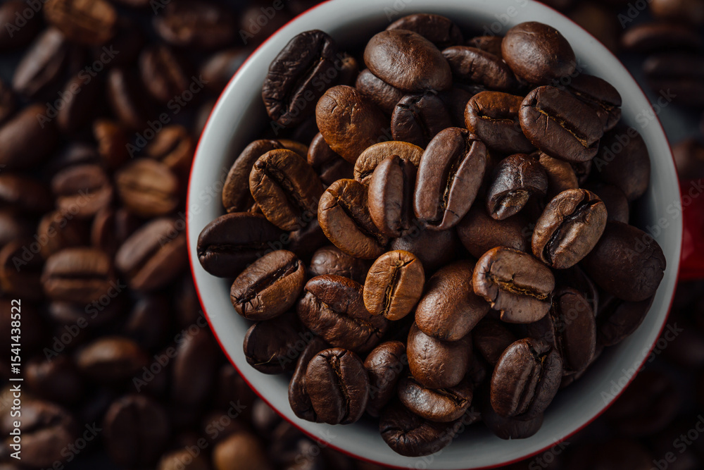 Fototapeta premium Close-Up of Fresh Coffee Beans in a Red and White Cup