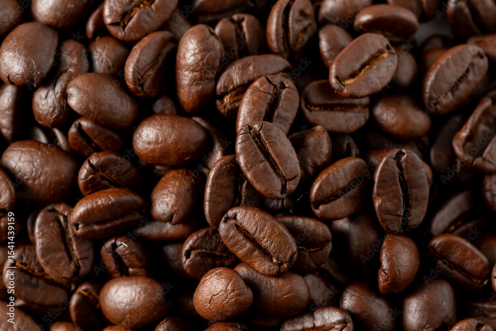 Freshly Roasted Dark Coffee Beans Over a Neutral Background Freshly Roasted Dark Coffee Beans Over a Neutral Background