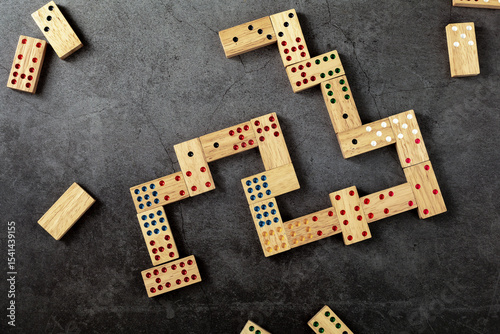 Colorful Dominoes Arranged on a Dark Surface for Creative Play