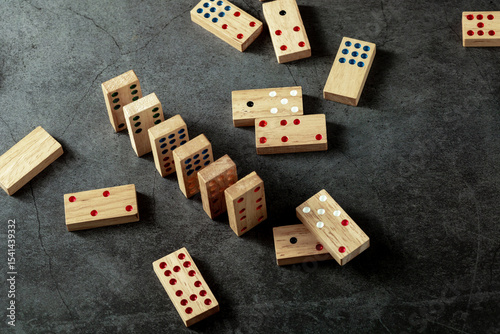 Wooden Dominoes Arranged on Dark Surface for Game and Recreation