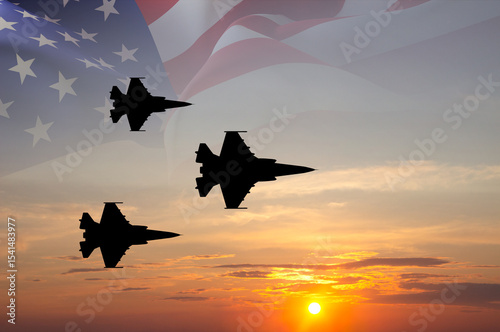 Fotografie Fighter aircrafts with USA flag against the sunset sky