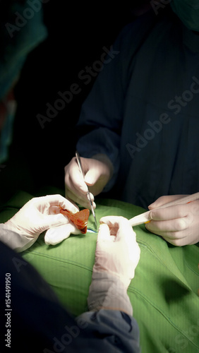 Surgeons Performing Surgery in Hospital Operating Room Close up Portrait View