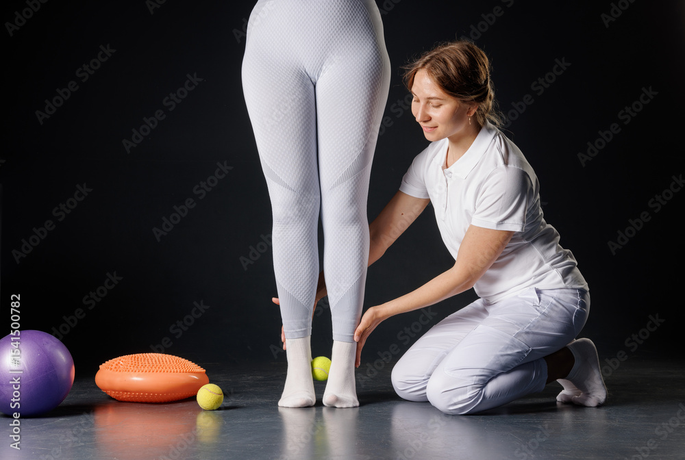 Naklejka premium Physiotherapist Supporting Female Patient During Balance and Stability Training for Rehabilitation