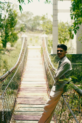 Man Walking Down Steps Toward Lake in Nature