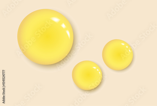 Oil vitamin C serum drops. Liquid droplets on yellow background. Cosmetic product with bubbles closeup