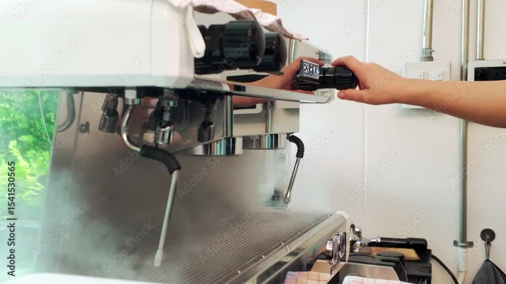 Barista operating commercial espresso machine, preparing coffee in a modern cafe. Steam rising from portafilters, highlighting the process of brewing fresh espresso in a professional setting. Barista operating commercial espresso machine, preparing coffee in a modern cafe. Steam rising from portafilters, highlighting the process of brewing fresh espresso in a professional setting.