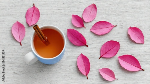 Autumnal Tea in a Blue Mug with Pink Leaves