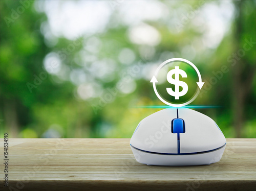 Money transfer icon with wireless computer mouse on wooden table over blur green tree in park, Business currency exchange online service concept