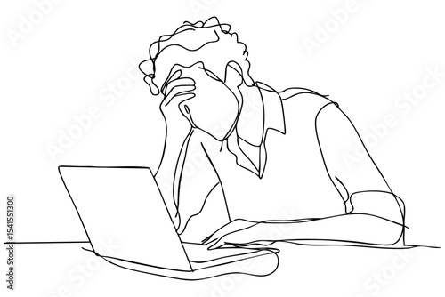 Person in distress while working on a laptop at a desk during daytime
