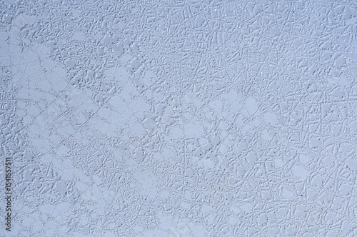 Intricate patterns are revealed in this high-resolution macro shot of a cracked, weathered surface.