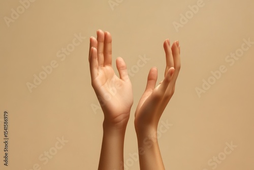 Beauty concept, well-kept hands of young model, neutral background