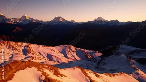 Mountain peaks bathed in sunrise hues