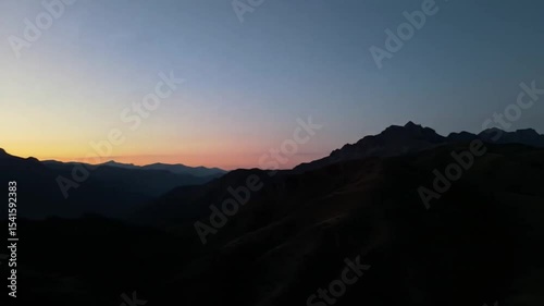 Mountain silhouettes at sunrise
