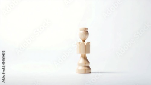 A wooden chess piece stands alone on a minimalist background, symbolizing strategy and focus