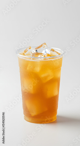 Refreshing iced tea with ice cubes in clear plastic cup - Beverage, Drink, and Refreshment Industry