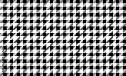 Seamless tartan check design for fabric, fashion, wrapping, digital paper, or rustic decoration projects.Black and white buffalo plaid pattern with diagonal lines.