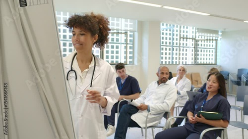 Doctor giving a presentation to medical staff in slow motion