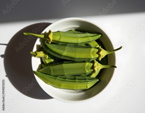Fresh Green Okra in White Bowl Healthy Vegan Food Overhead Shot