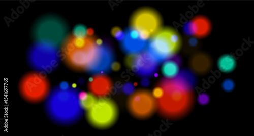 Multicolored glowing circles on dark background. Blurred soft shapes of various sizes create abstract festive atmosphere.