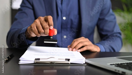 Business holding rubber stamp document approval verification. Corporate executive legal papers with official stamp document authentication. Notary service provider certify important business contract